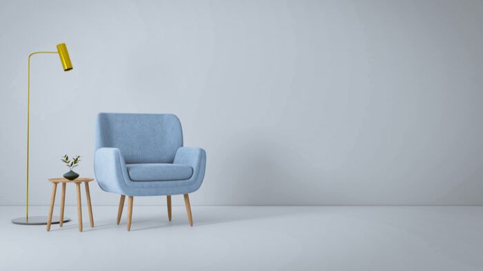Illustration of chair, small coffee table and lamp
