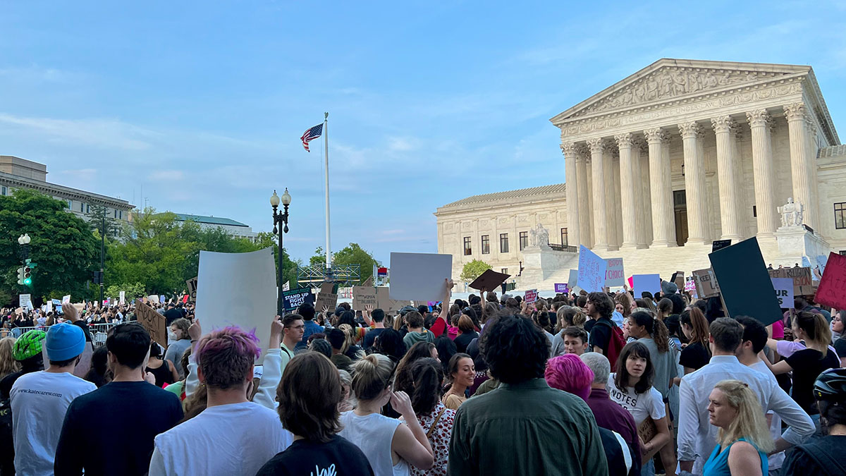 Image of crowd outside the Supreme Court.