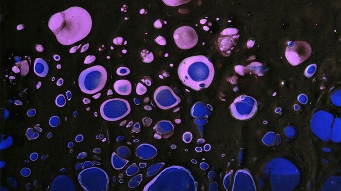A close up of blue and black bubbles