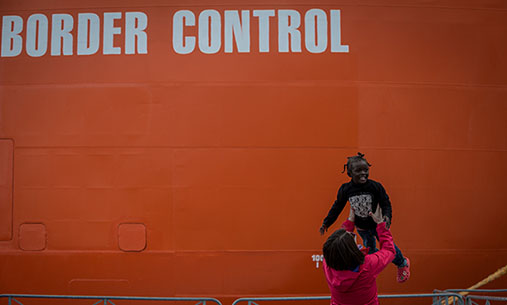 Young girl in front of the rescueship "Siem Pilot"