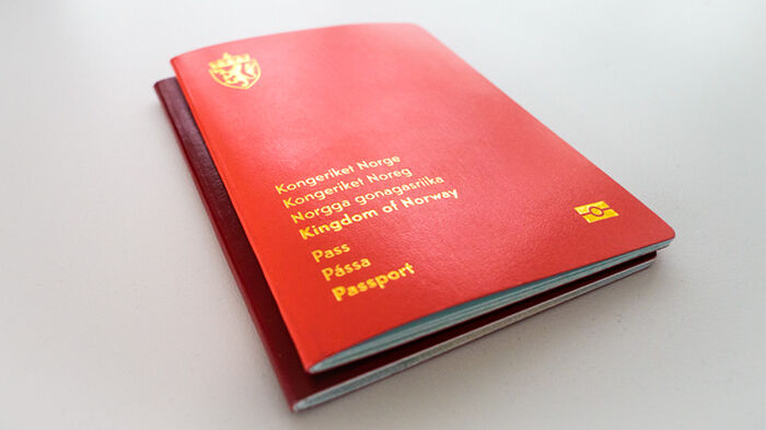 Two red Norwegian passports lying on top of each other.