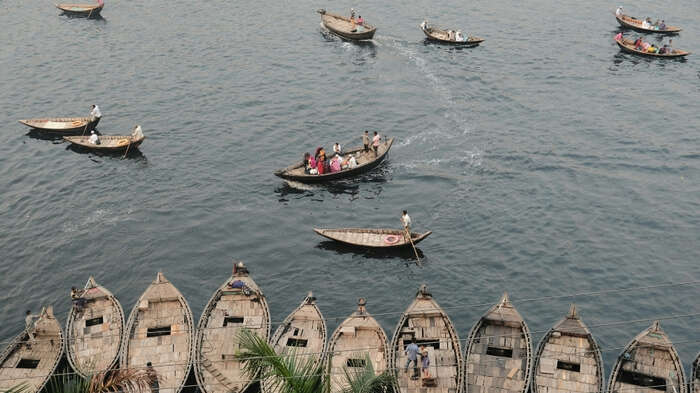 Photo of small boats in the water, taken in Bangladesh. The illustration includes the title of the conference: Call for Papers: The Refugee Convention at 75: Perspectives Within and Beyond and its date: 22-23 June, 2026.