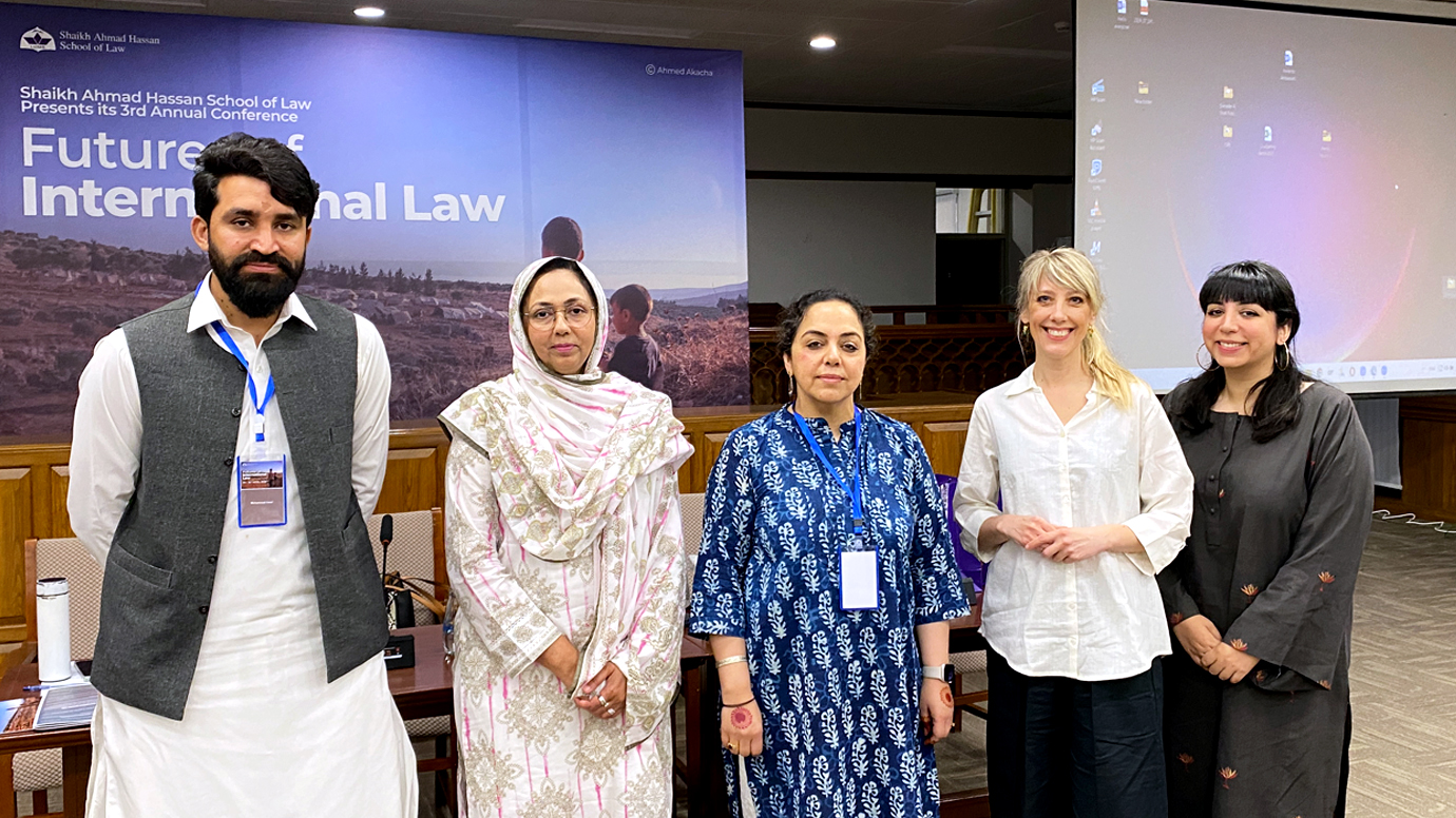Group picture of the four panalists, including the moderator of the discussion. 