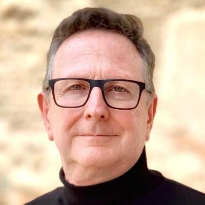 Fotografiet er et portrettbilde av Andrew Clapham. Illustrasjonen brukes med tillatelse fra Geneva Graduate Institute