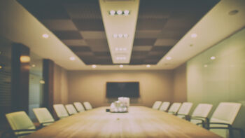 Illustration photo of a hazy board room with chairs