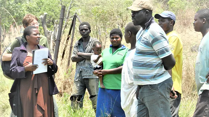A group of people doing field work outside.