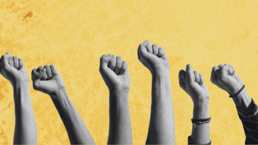 Several firsts are risen in the air, worn out yellow background.