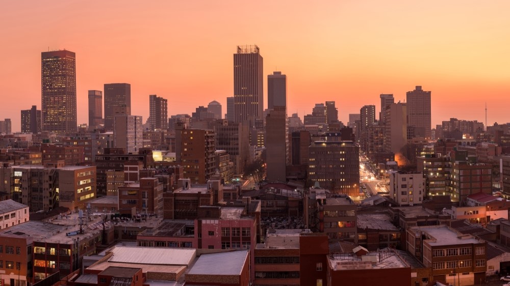 Landscape view of Johannesburg city skyline at sunset 