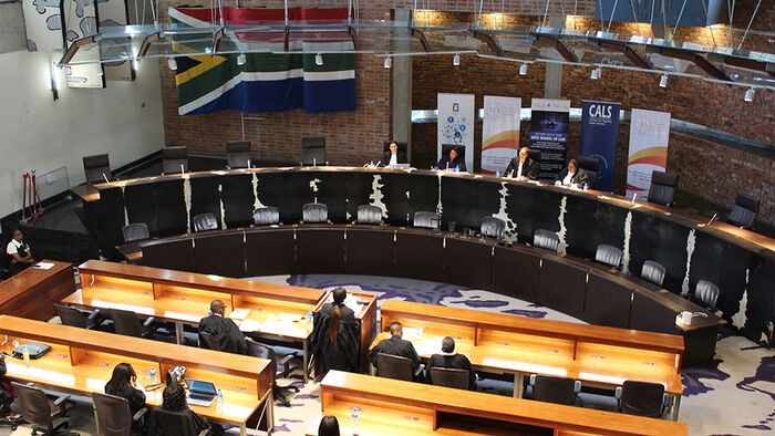 Image of a court room and proceedings in South Africa. 