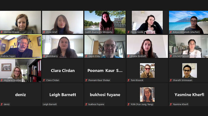 Screenshot of a Zoom conference with 20 small images of participants.