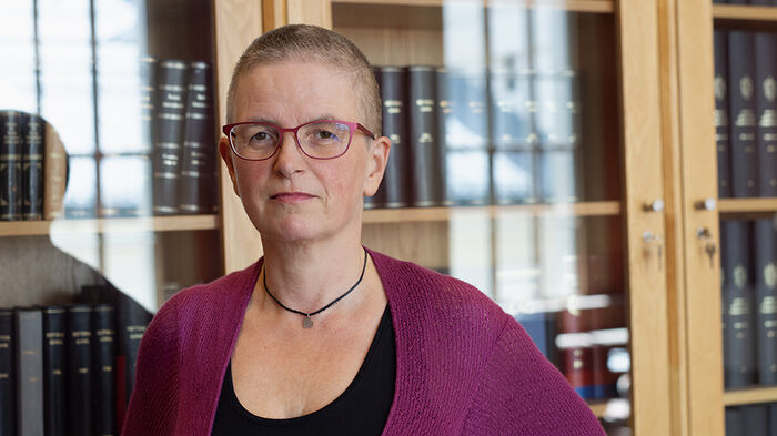 face, woman, bookshelf